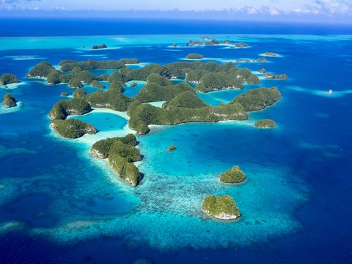 Image of a dramatic southern hemisphere coastline and mountains.